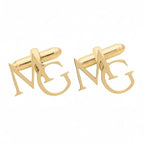 Custom gold monogram cufflinks with letters M and G for men's formal shirts.
