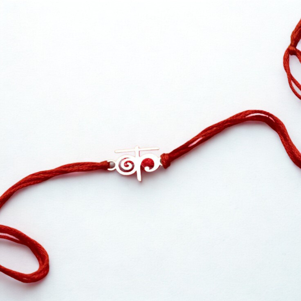Custom Alphabet Rakhi in Hindi Style with Red Thread by Moskai