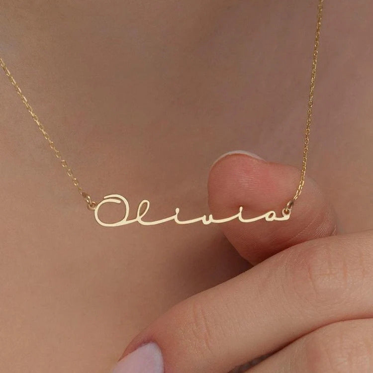 signature name jewellery gold finish close up